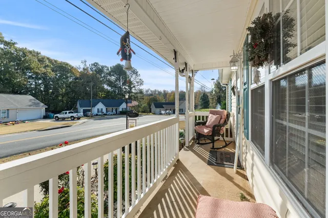 a view of a balcony with chairs