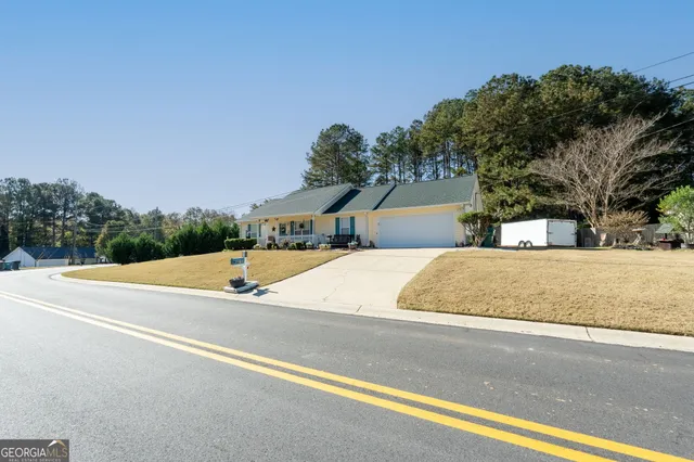 a view of the house with a road