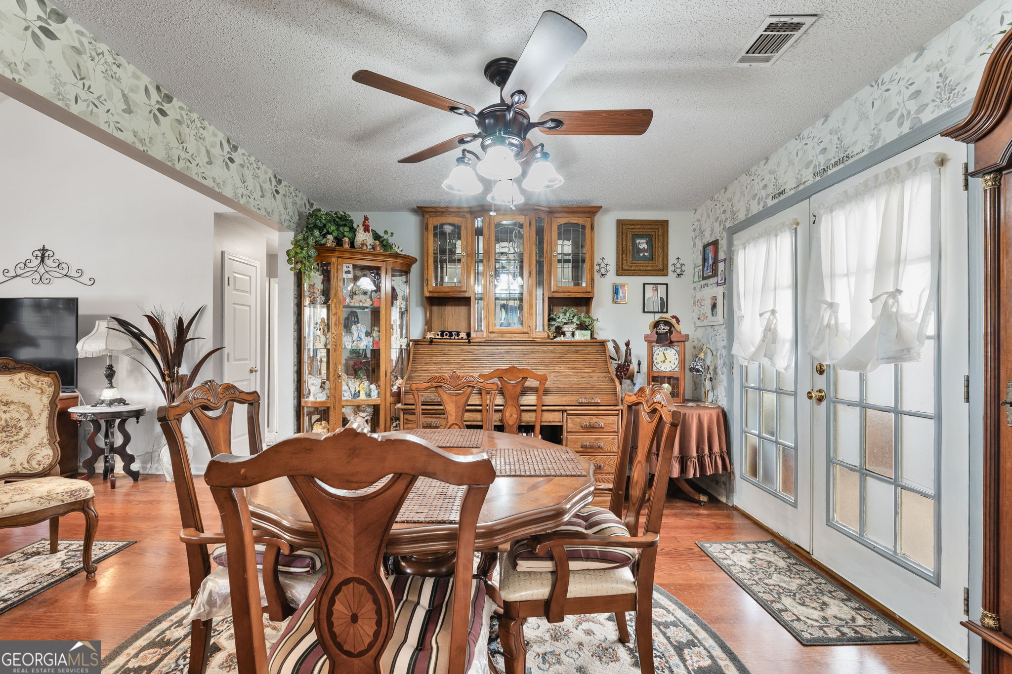 291 Regal Road Jackson, GA 30233 - Photo 6 of 35 a dining room with furniture window and wooden floor