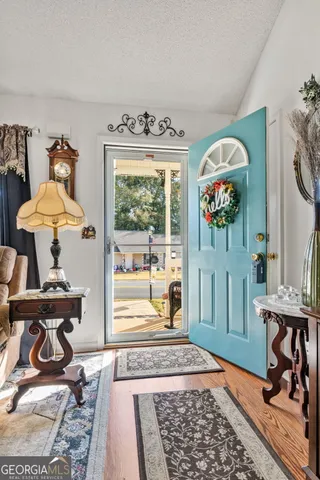 a bedroom with furniture and a window