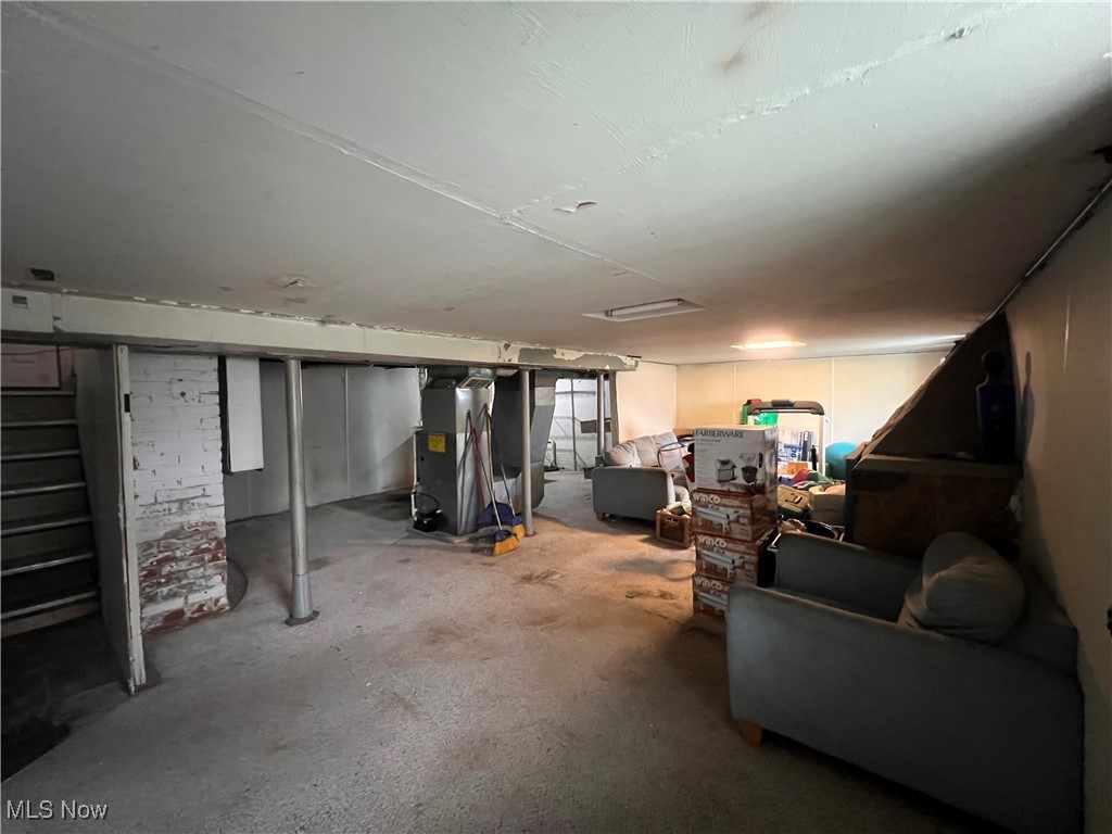 1686 Avalon Road Cleveland, OH 44112 - Photo 18 of 22 Basement with stairs and heating unit