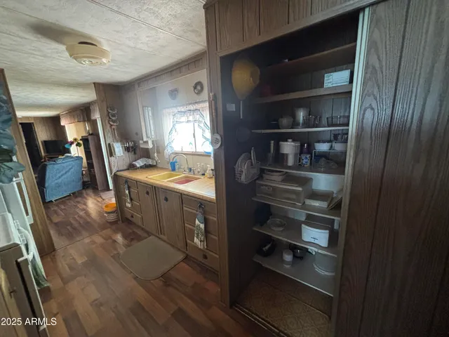 a kitchen with a refrigerator and a stove