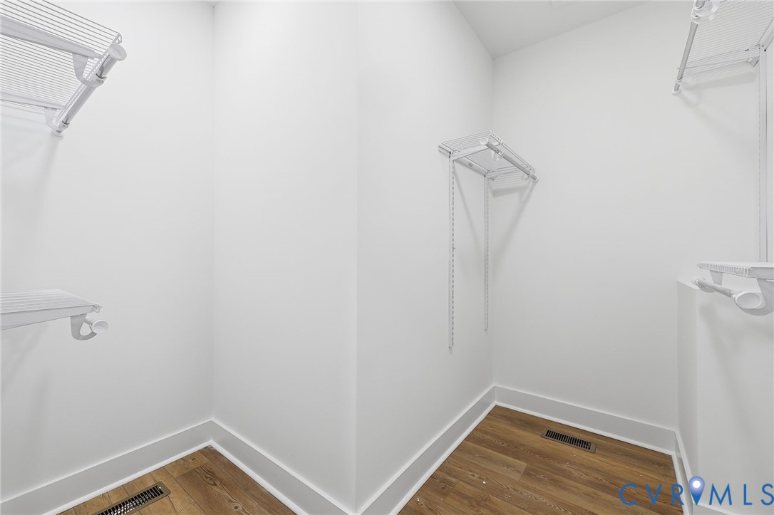 2255 Bagby Road Bumpass, VA 23024 - Photo 17 of 30 a view of a room with wooden floor and white walls