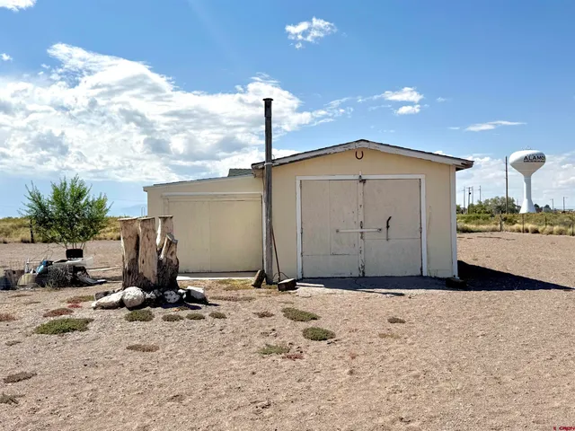 a view of a backyard of the house