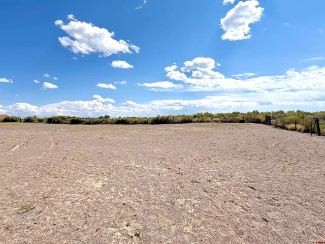a view of a lake with sunset