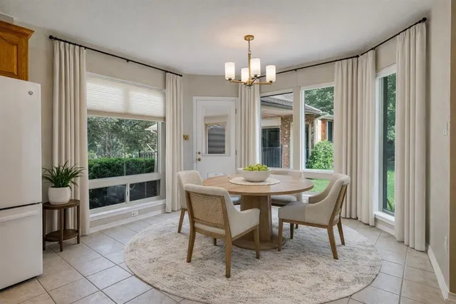 a living room with furniture and a book shelf