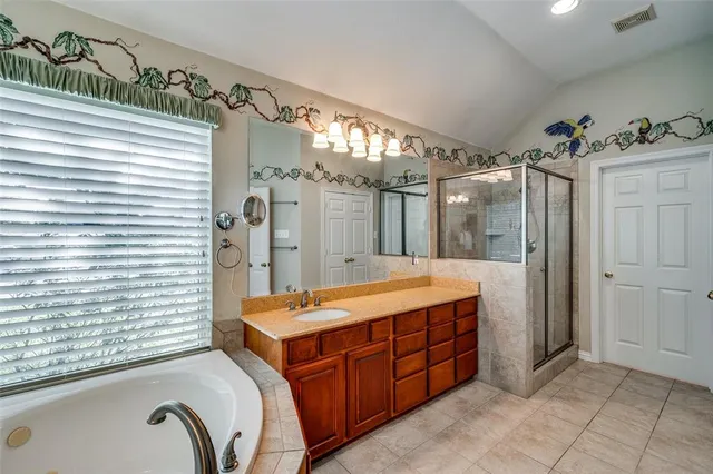 a spacious bedroom with a large bed and a window