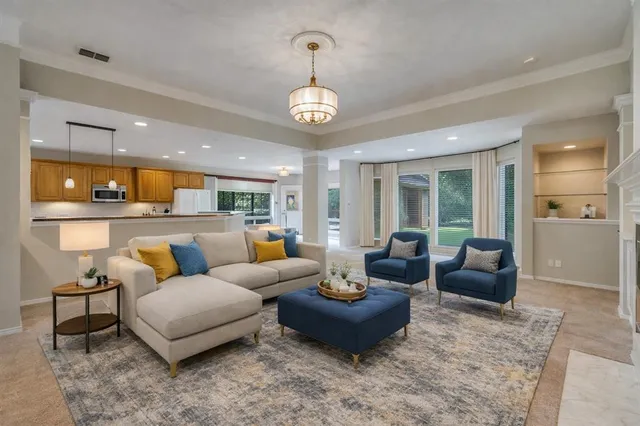 a view of kitchen with furniture and refrigerator
