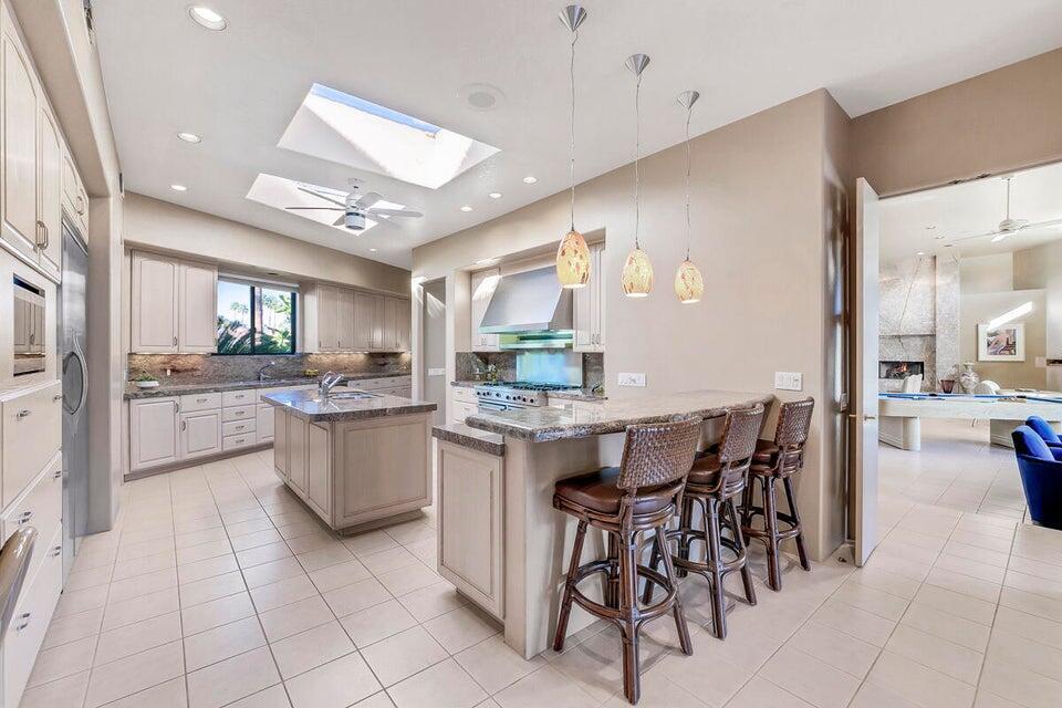45625 Apache Road Indian Wells, CA 92210 - Photo 12 of 33 a kitchen with a sink and cabinets