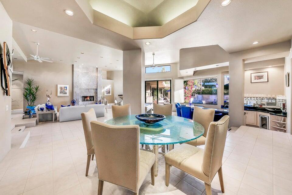 45625 Apache Road Indian Wells, CA 92210 - Photo 15 of 33 a view of a dining room with furniture and a potted plant