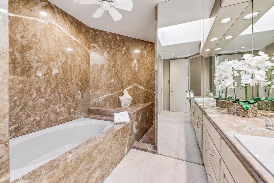 45625 Apache Road Indian Wells, CA 92210 - Photo 18 of 33 a spacious bathroom with a bathtub and shower