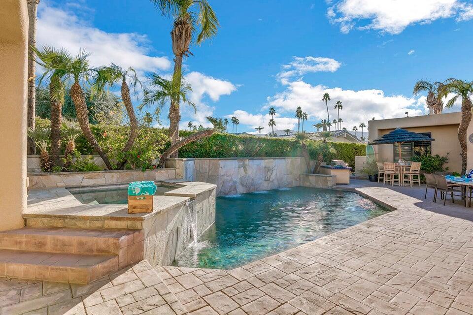 45625 Apache Road Indian Wells, CA 92210 - Photo 29 of 33 a view of a swimming pool with a patio
