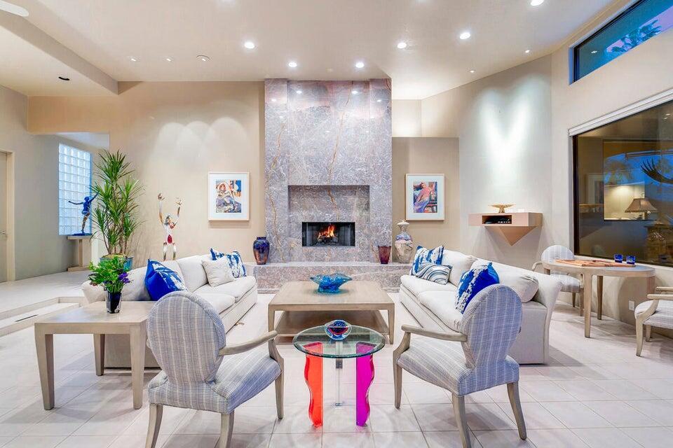 45625 Apache Road Indian Wells, CA 92210 - Photo 3 of 33 a living room with fireplace furniture and a flat screen tv
