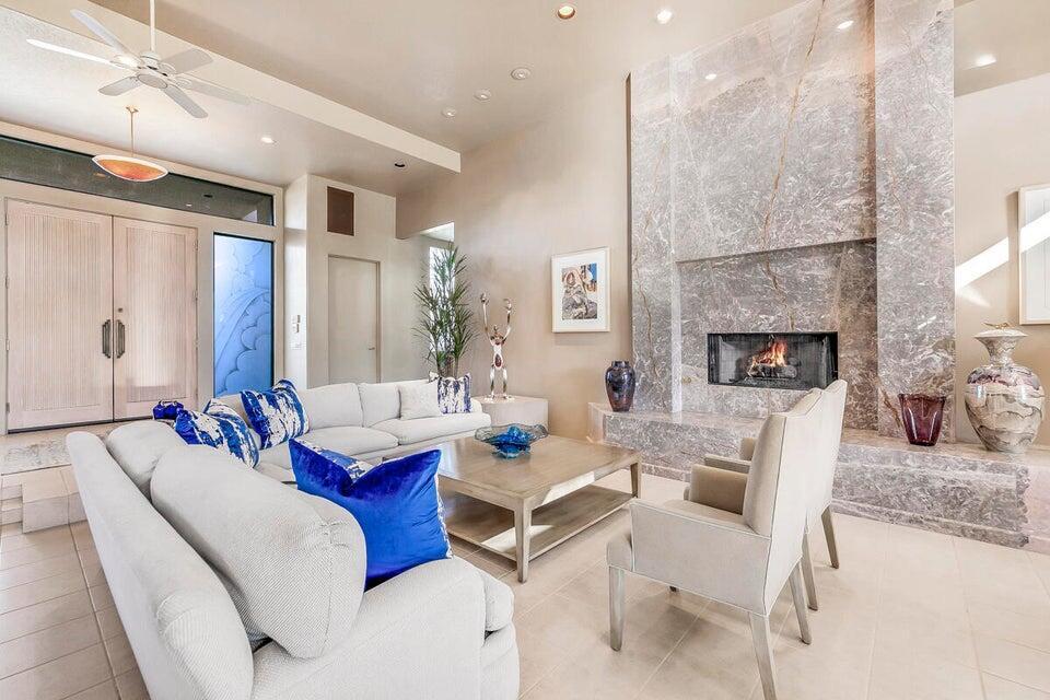45625 Apache Road Indian Wells, CA 92210 - Photo 6 of 33 a living room with furniture fireplace and a fireplace