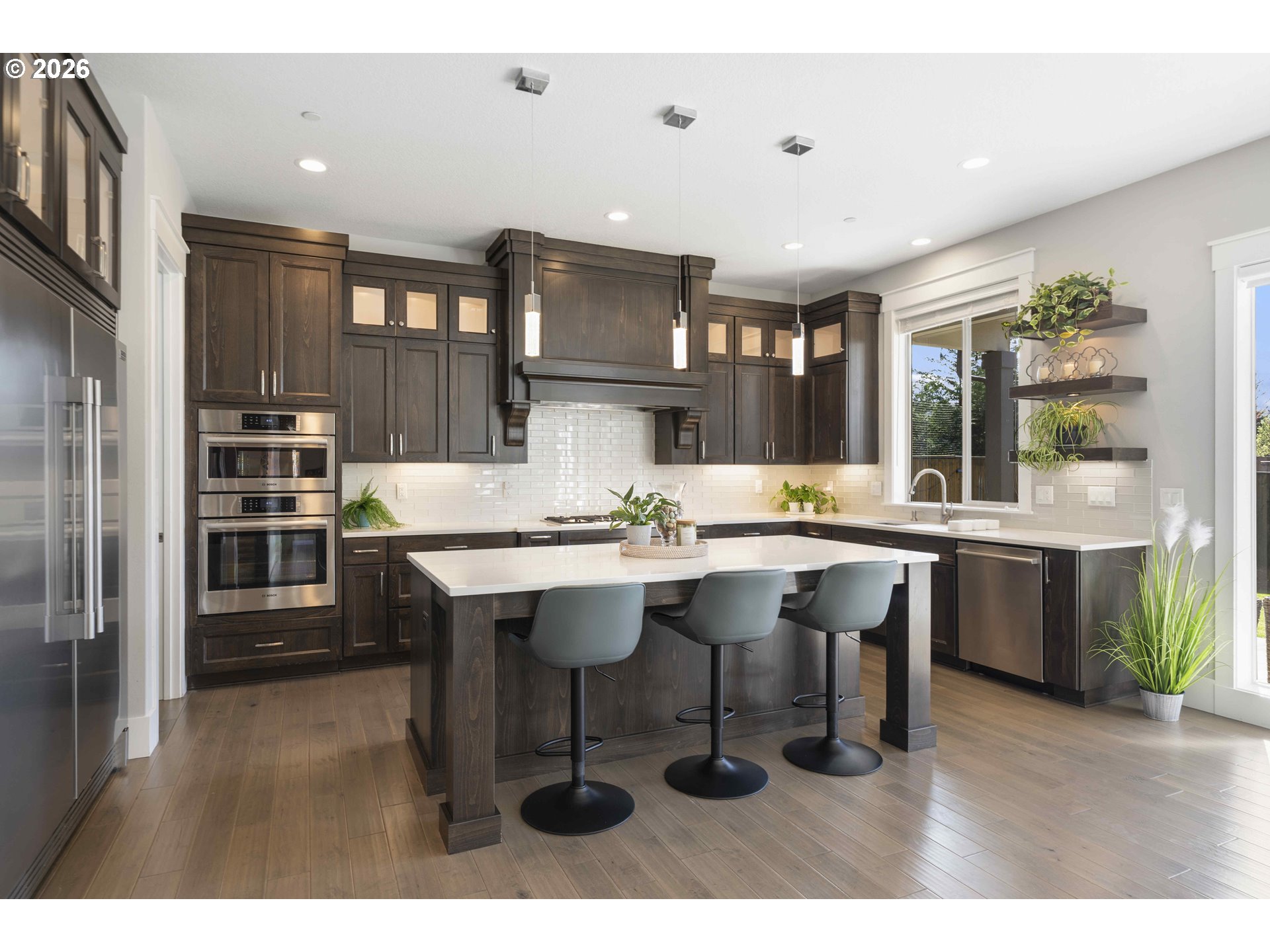 2036 Northwest 44th Avenue Camas, WA 98607 - Photo 13 of 48 a kitchen with a sink cabinets and wooden floor