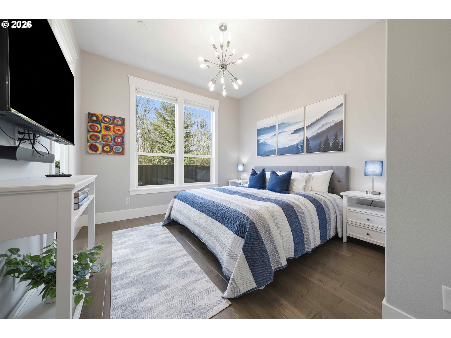 2036 Northwest 44th Avenue Camas, WA 98607 - Photo 26 of 48 a bedroom with a large bed and a flat tv screen