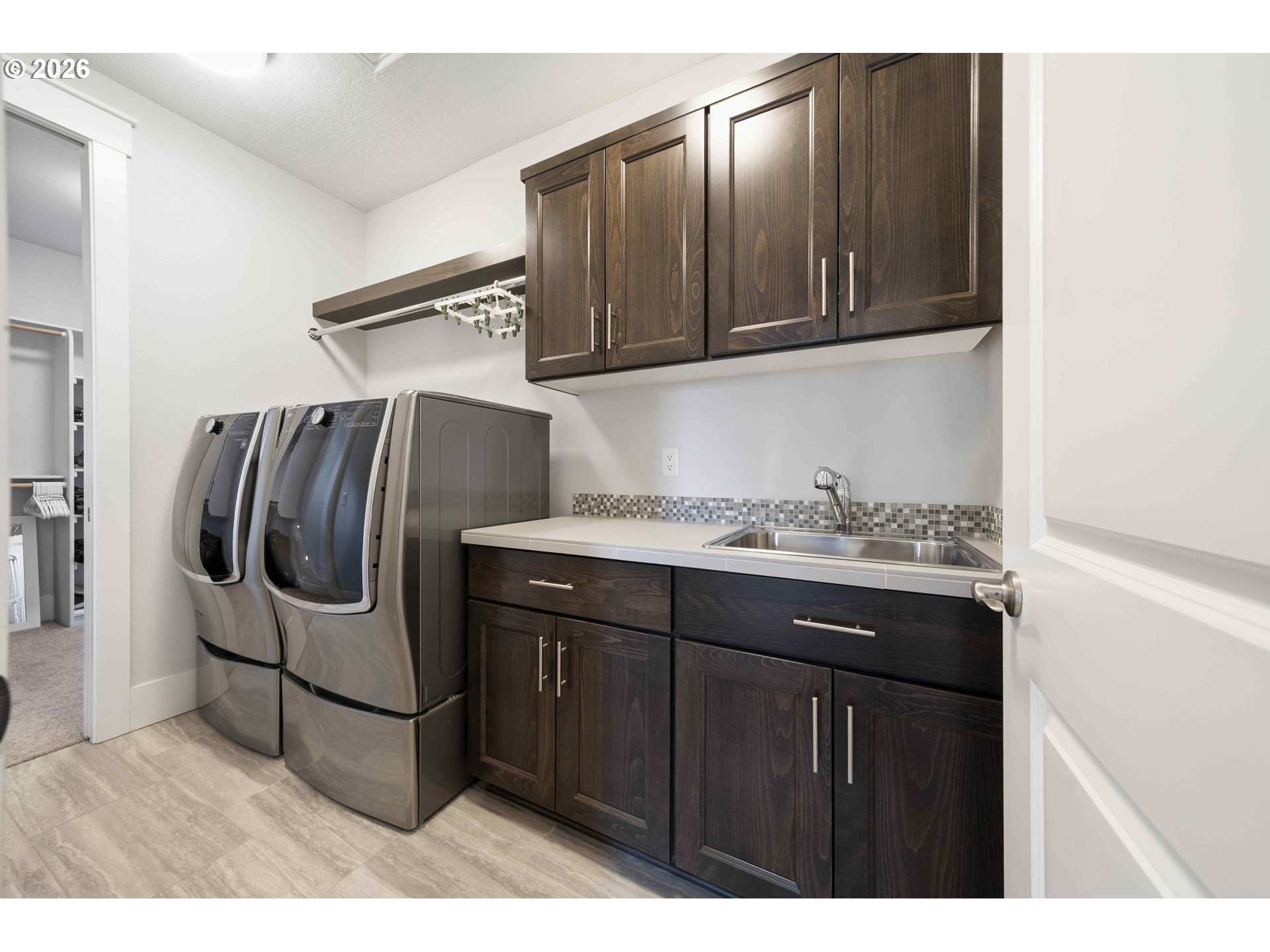 2036 Northwest 44th Avenue Camas, WA 98607 - Photo 38 of 48 a kitchen with a sink and cabinets