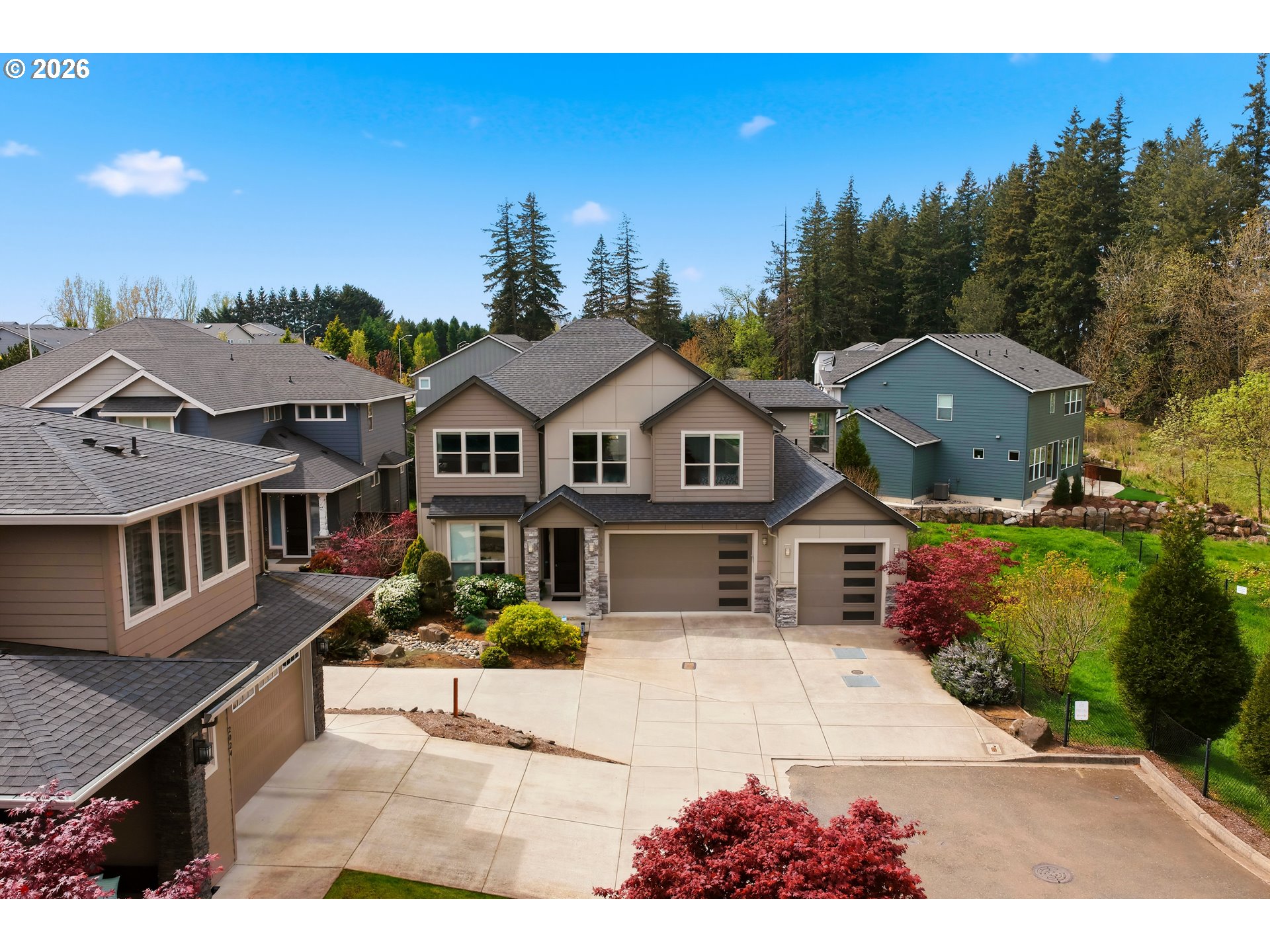 2036 Northwest 44th Avenue Camas, WA 98607 - Photo 46 of 48 a view of a white house with a big yard and potted plants