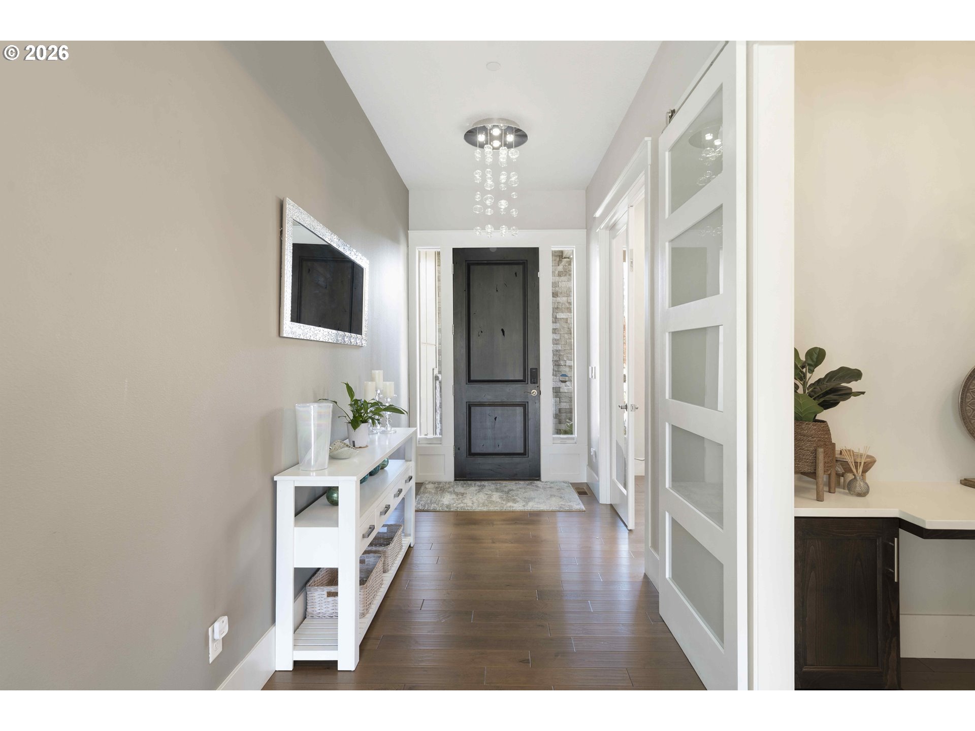 2036 Northwest 44th Avenue Camas, WA 98607 - Photo 5 of 48 a view of a hallway with wooden floor and staircase