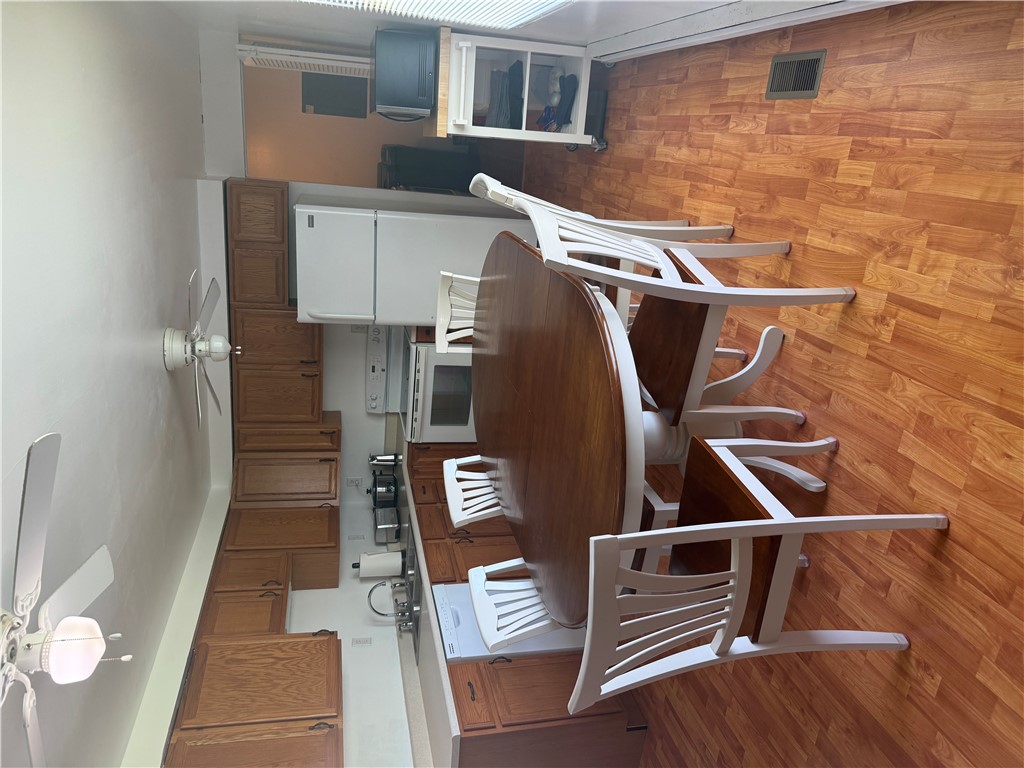5840 Pitchin Road South Springfield, OH 45502 - Photo 5 of 18 This spacious kitchen offers ample cabinetry, modern appliances, and a comfortable dining area for everyday living.