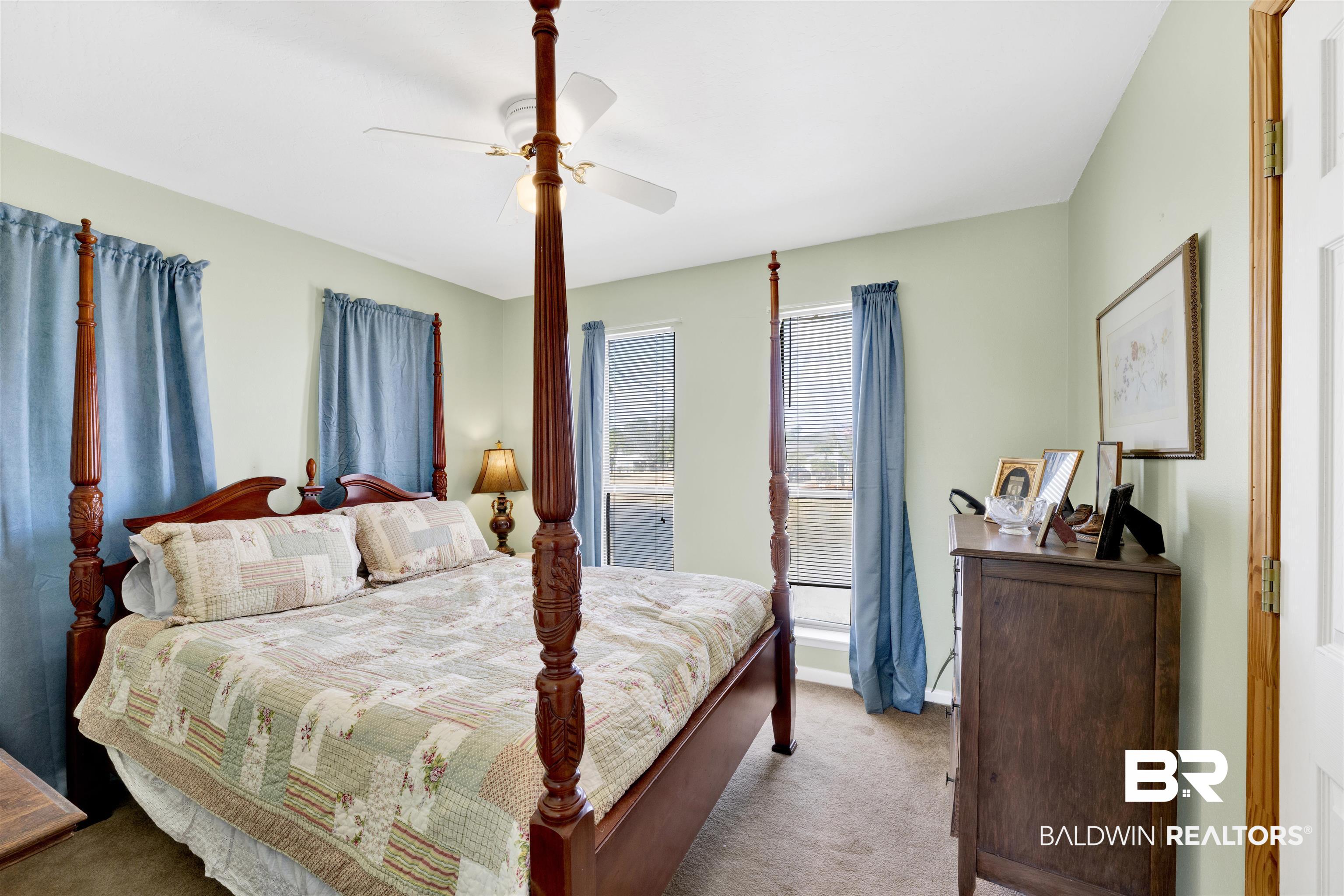 26222 Marina Road Orange Beach, AL 36561 - Photo 24 of 38 Carpeted bedroom with a ceiling fan