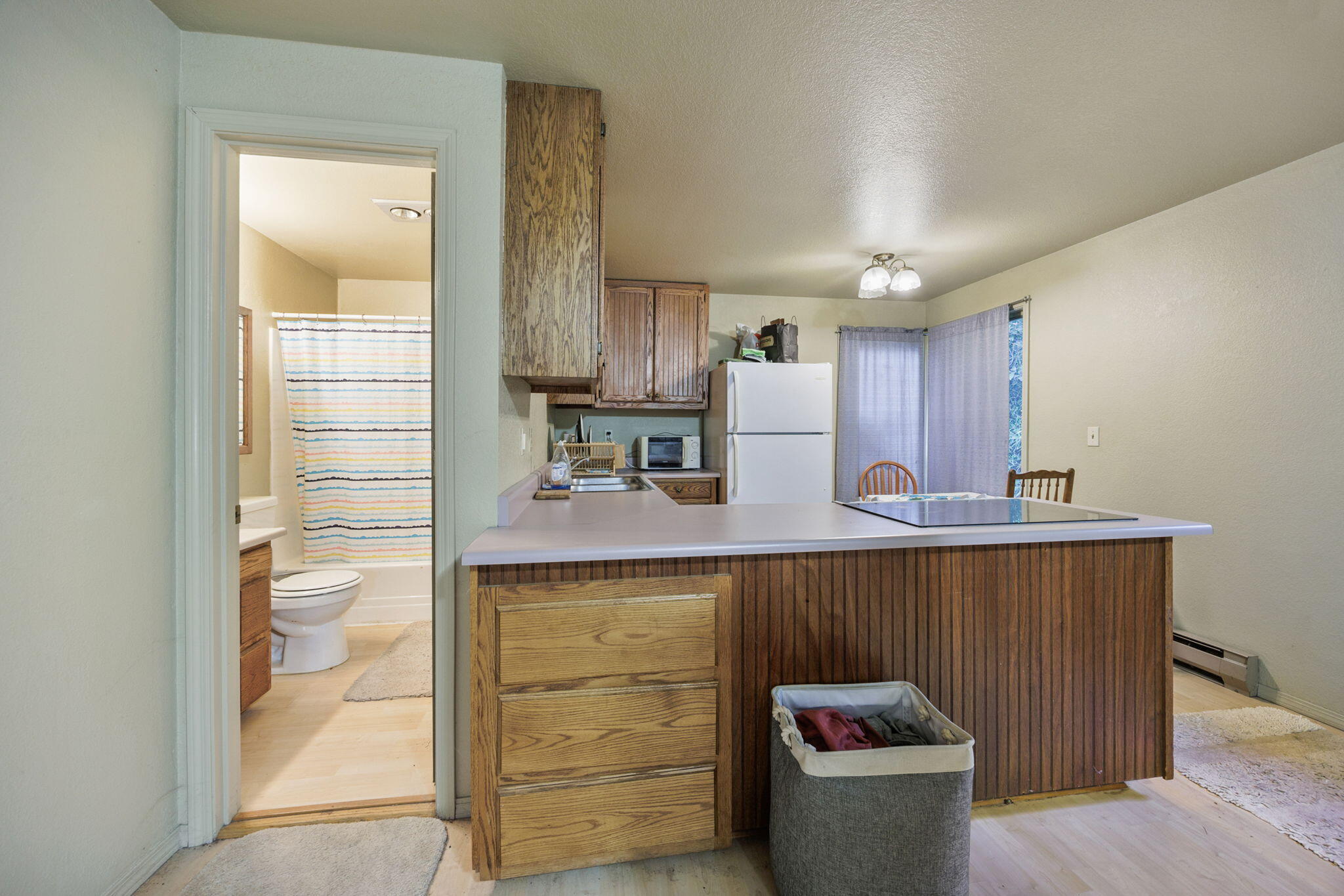 75 Wimer Street Ashland, OR 97520 - Photo 36 of 44 a kitchen with a sink and wooden cabinets