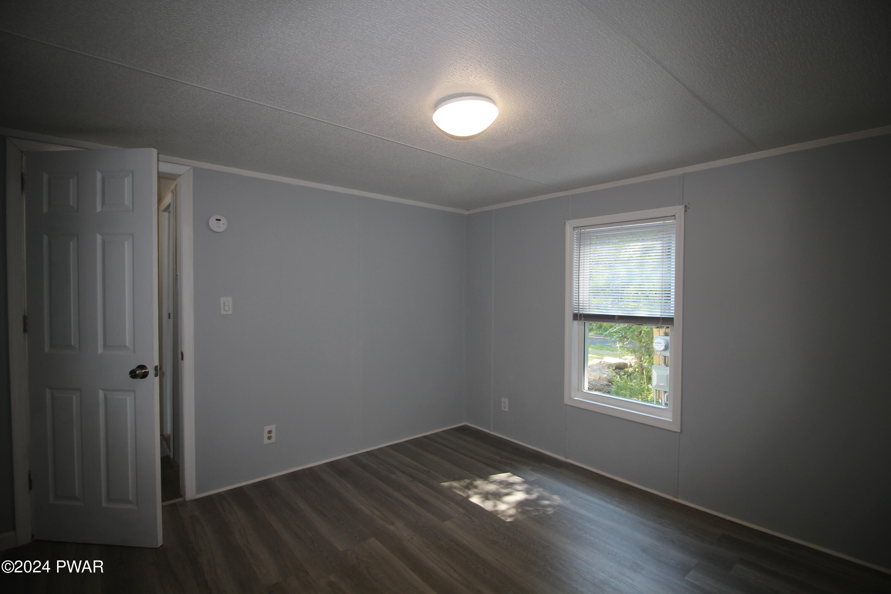 77 Pond Road Lake Ariel, PA 18436 - Photo 16 of 36 an empty room with a window