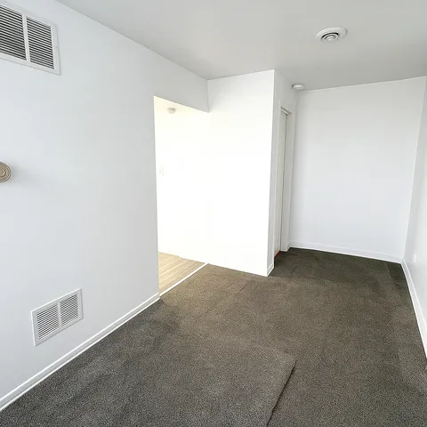 a view of a room with an empty space