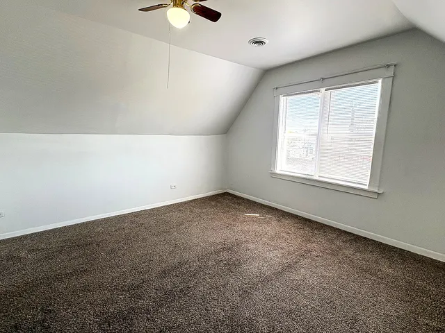 an empty room with a empty space and windows
