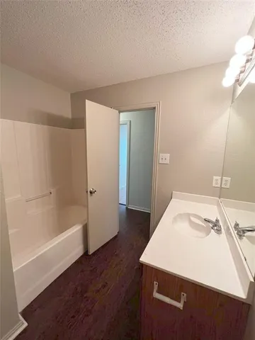 a bathroom with a sink and a bathtub