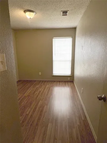 a view of a livingroom with wooden floor