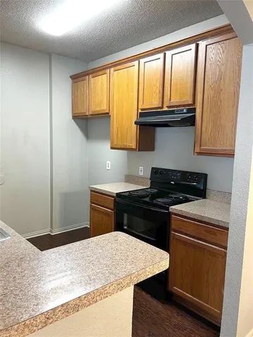 a kitchen with a stove and a refrigerator