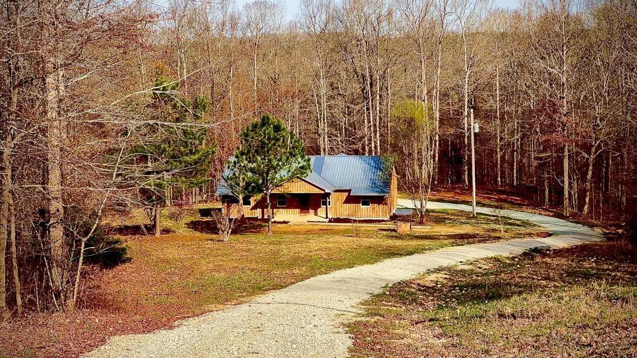 405 Napier Lake Road Hohenwald, TN 38462 - Photo 11 of 26 a view of a playground with basketball court