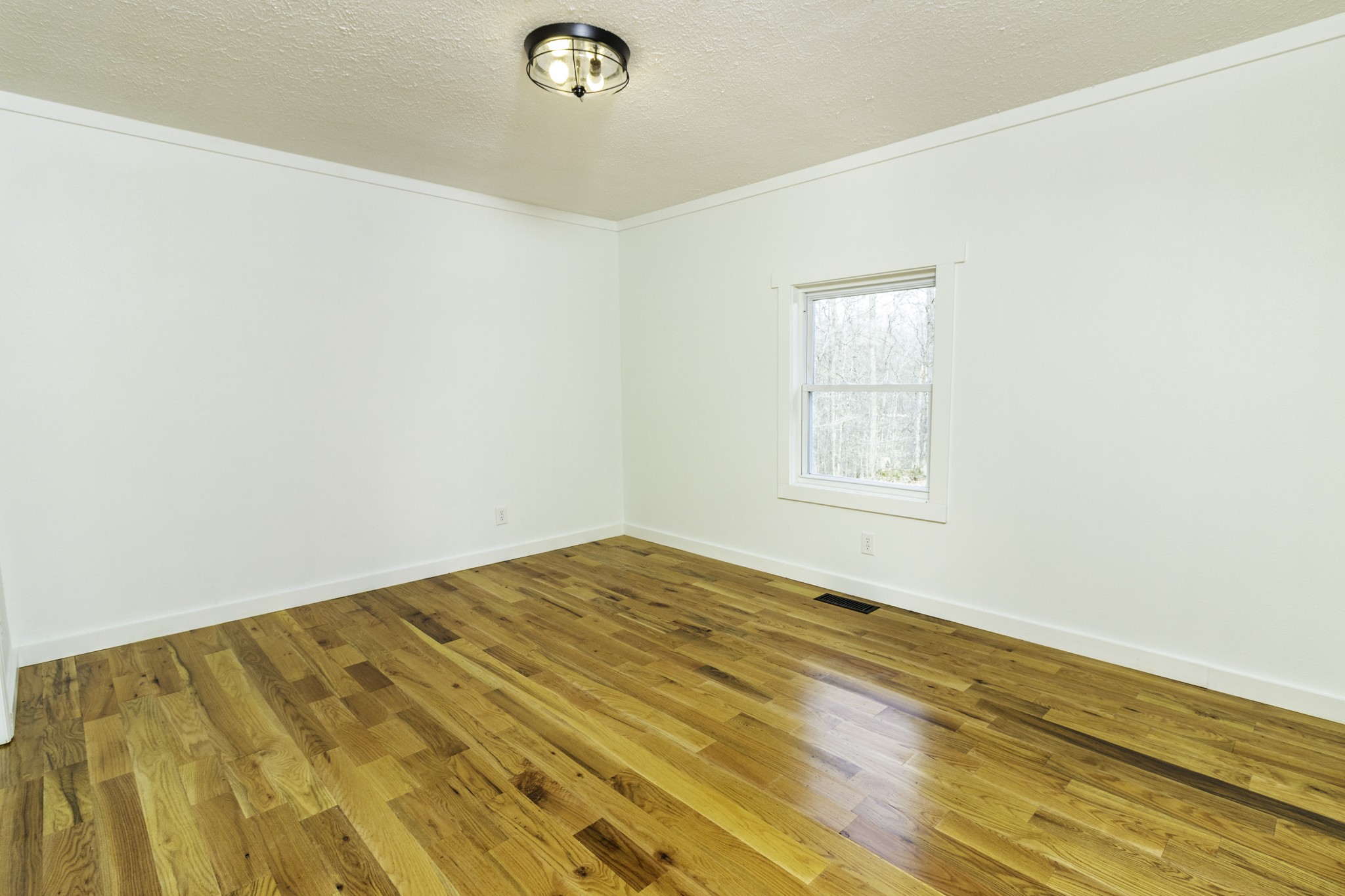 405 Napier Lake Road Hohenwald, TN 38462 - Photo 18 of 26 a view of empty room with wooden floor