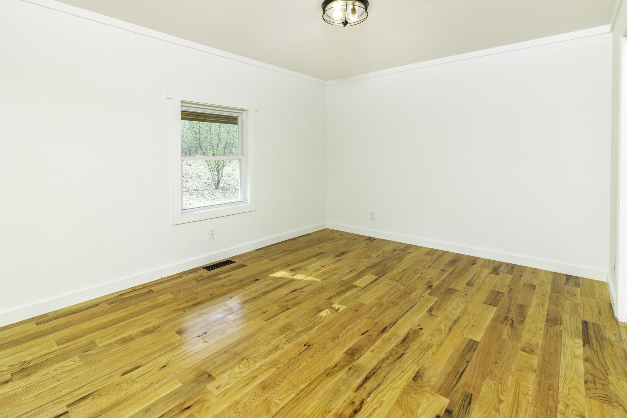 405 Napier Lake Road Hohenwald, TN 38462 - Photo 19 of 26 a view of empty room with wooden floor