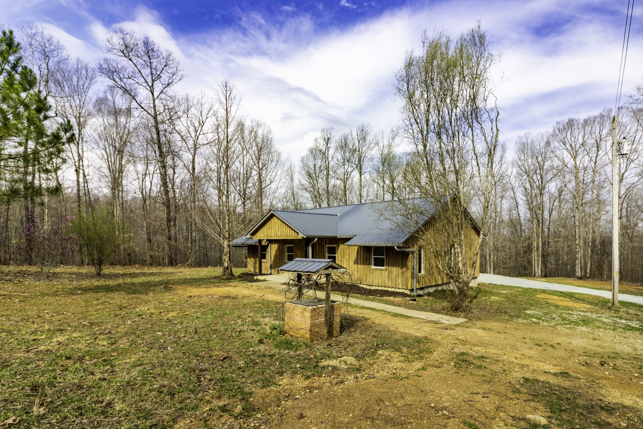 405 Napier Lake Road Hohenwald, TN 38462 - Photo 6 of 26 a house with swimming pool in front of it