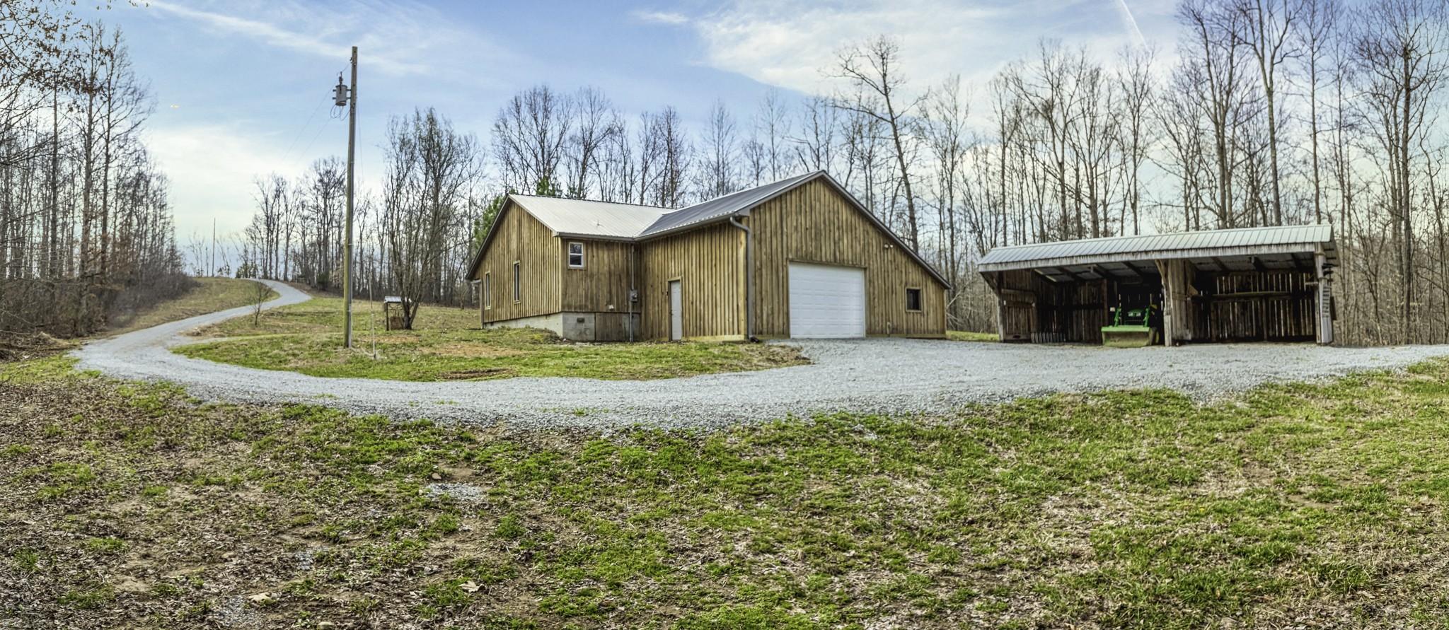 405 Napier Lake Road Hohenwald, TN 38462 - Photo 9 of 26 a front view of a house with a yard