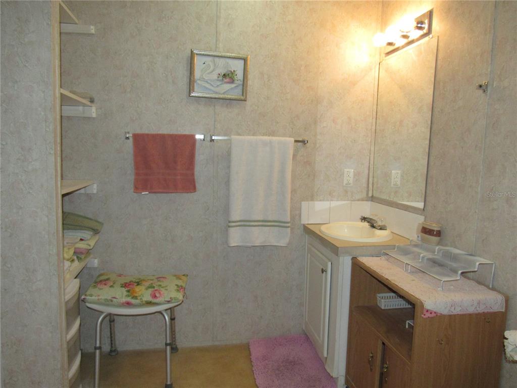 10101 Burnt Store Road, Unit 52 Punta Gorda, FL 33950 - Photo 15 of 37 a bathroom with a sink toilet and a mirror