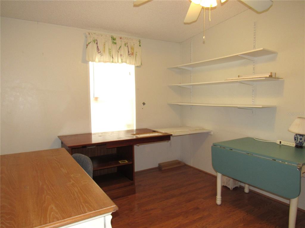 10101 Burnt Store Road, Unit 52 Punta Gorda, FL 33950 - Photo 19 of 37 a room with a table and chairs