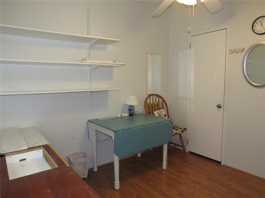 10101 Burnt Store Road, Unit 52 Punta Gorda, FL 33950 - Photo 20 of 37 a view of a workspace with furniture and wooden floor