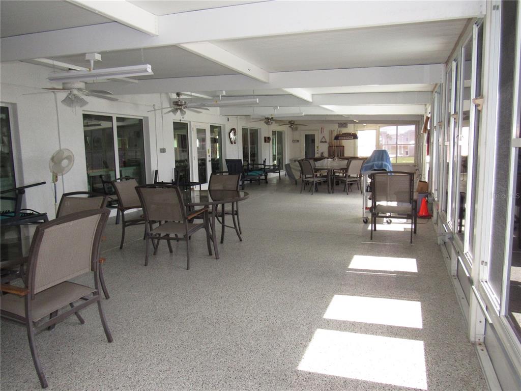 10101 Burnt Store Road, Unit 52 Punta Gorda, FL 33950 - Photo 25 of 37 a lobby with furniture and a chandelier
