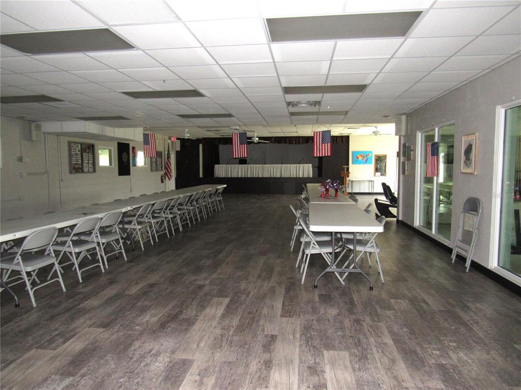 10101 Burnt Store Road, Unit 52 Punta Gorda, FL 33950 - Photo 28 of 37 a living room with lots of furniture and a wooden floor