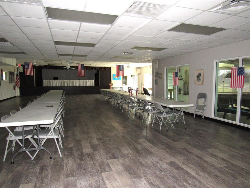 10101 Burnt Store Road, Unit 52 Punta Gorda, FL 33950 - Photo 29 of 37 a living room with furniture a wooden floor and a window