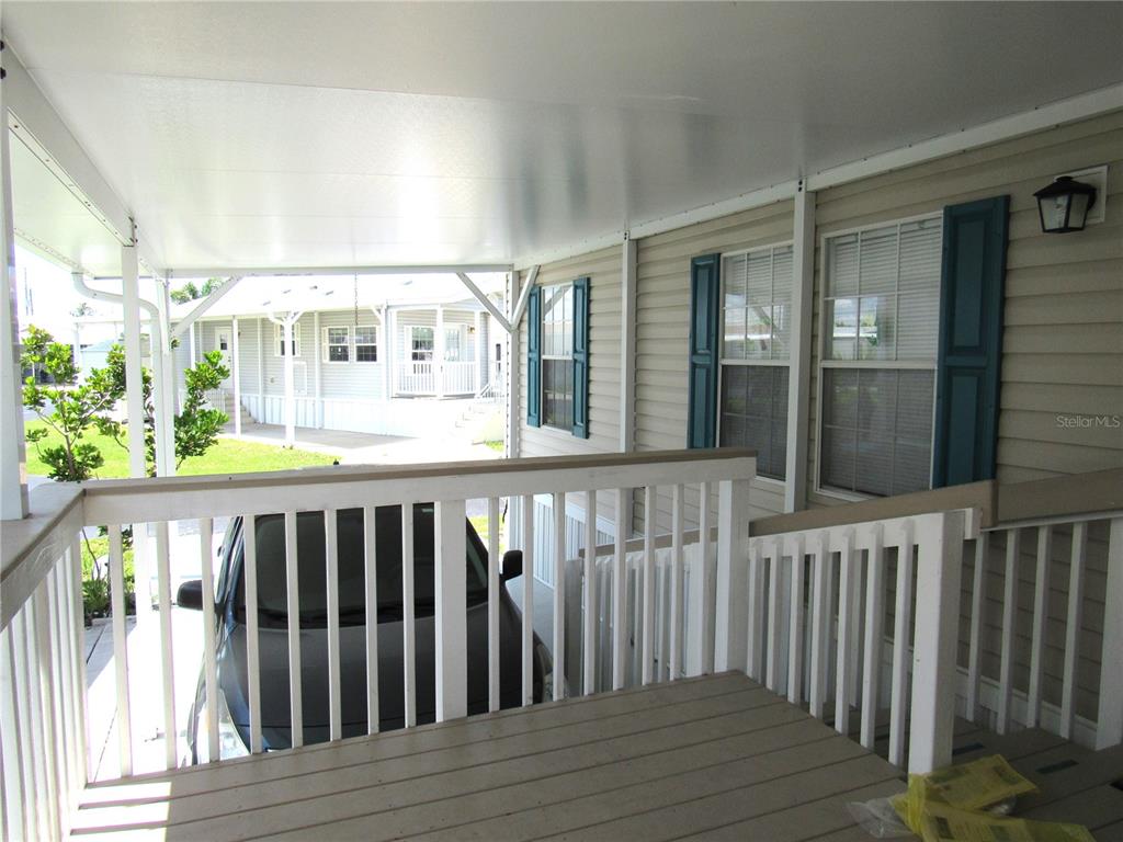 10101 Burnt Store Road, Unit 52 Punta Gorda, FL 33950 - Photo 4 of 37 a view of wooden deck