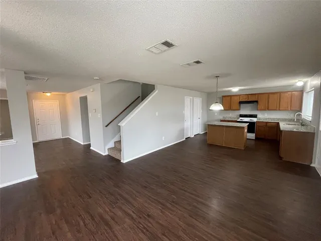 a view of kitchen with wooden floor