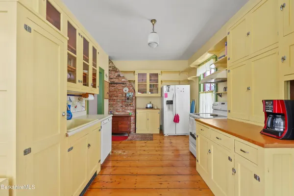 a view of a dining room with furniture and a window