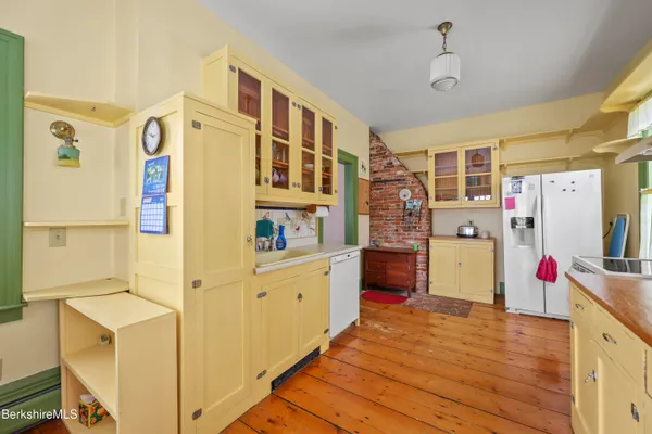 a view of a dining room with furniture and a window