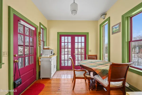 a view of a livingroom with furniture and a window