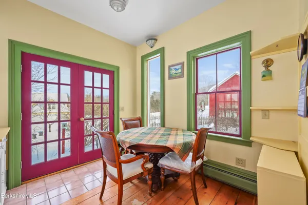 a living room with furniture a fireplace and a book shelf