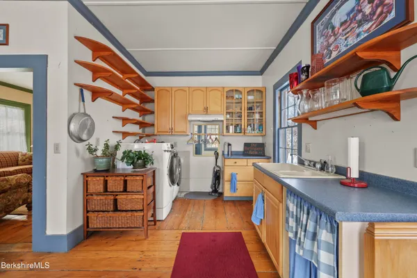 a bathroom with a sink toilet and mirror